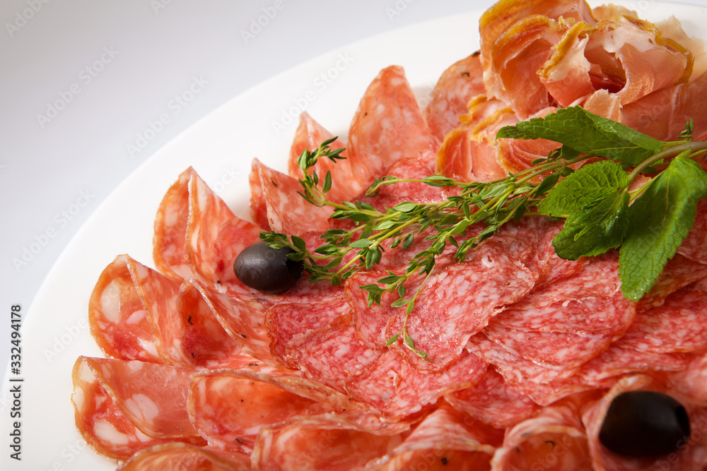 Assortment of cold meats and sausage isolated on white background Assortment of cold meats and sausage isolated on white background