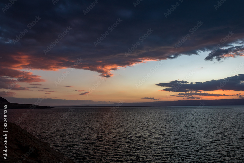 Colorful dramatic sky at sunset at Dead Sea as seen from Eastern coast, Middle East, Kingdom of Jordan