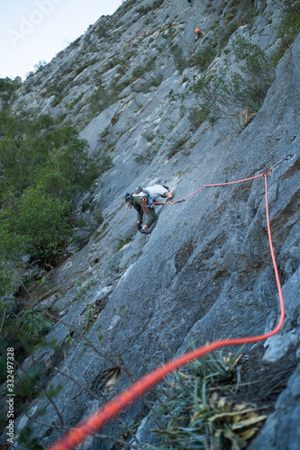 Mountain Climber making moves on a multipitch on Mexican limestone. photo