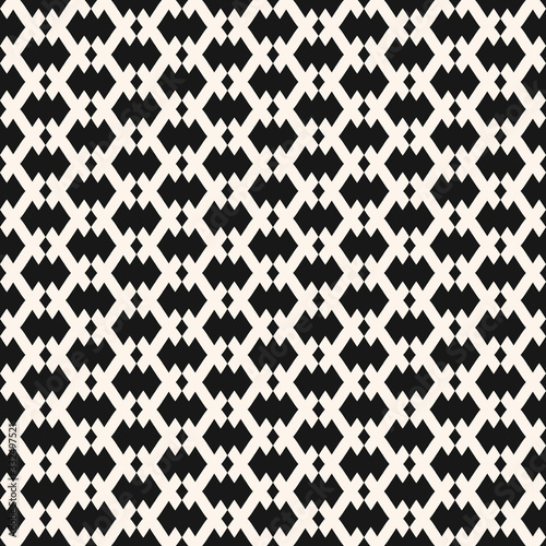Vector geometric seamless pattern in traditional ethnic style. Tribal folk motif. Black and white ornament with small rhombuses, diamonds, grid, net. Abstract monochrome background. Repeat texture