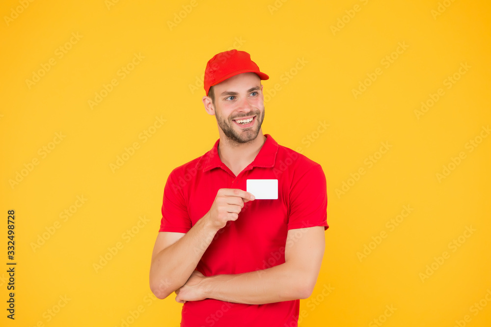 home delivery using credit card as payment. Pizza delivery man hold business card. man pay deliverer. pay with bank card. methods of payment with terminal. Delivery concept. postman in red uniform
