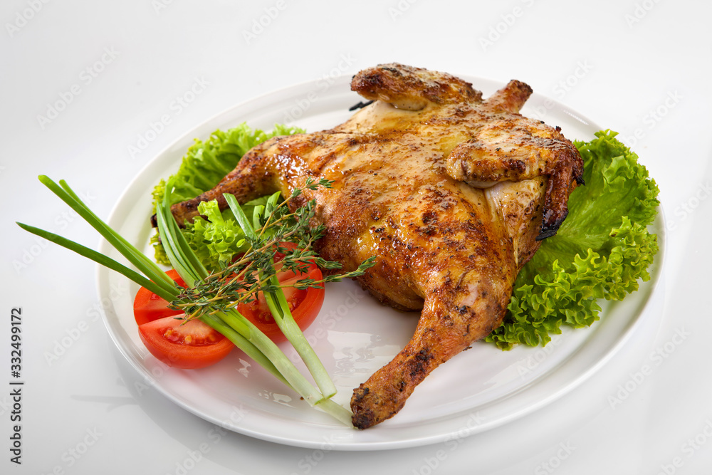 Roast chicken isolated on white background. Chicken tobacco Roast chicken isolated on white background. Chicken tobacco
