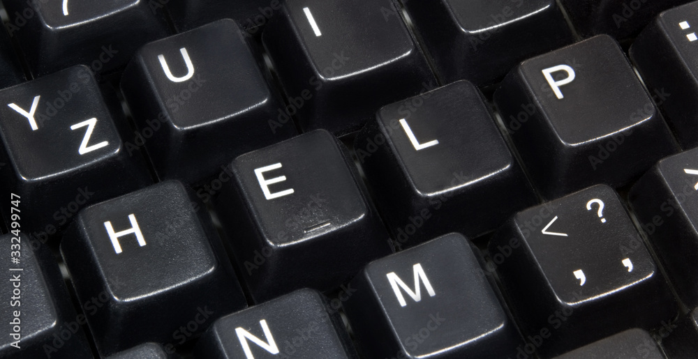 Close-up of word help on black computer keyboard. Close-up of word help on black computer keyboard.