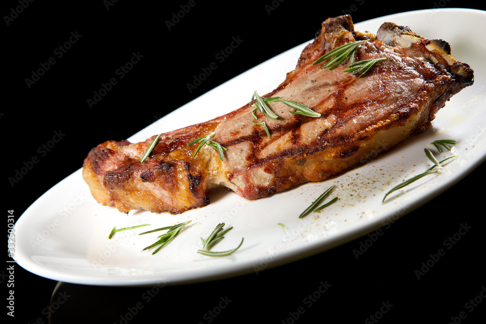 Appetizing grilled rib isolated on white background. Grilled mutton rib with blood Appetizing grilled rib isolated on white background. Grilled mutton rib with blood