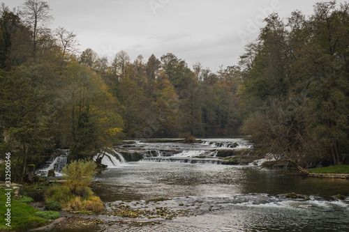 Beautiful natural cascades on the river of Krka close to the castle of Zuzemberk in Slovenia on a cold autumn day.