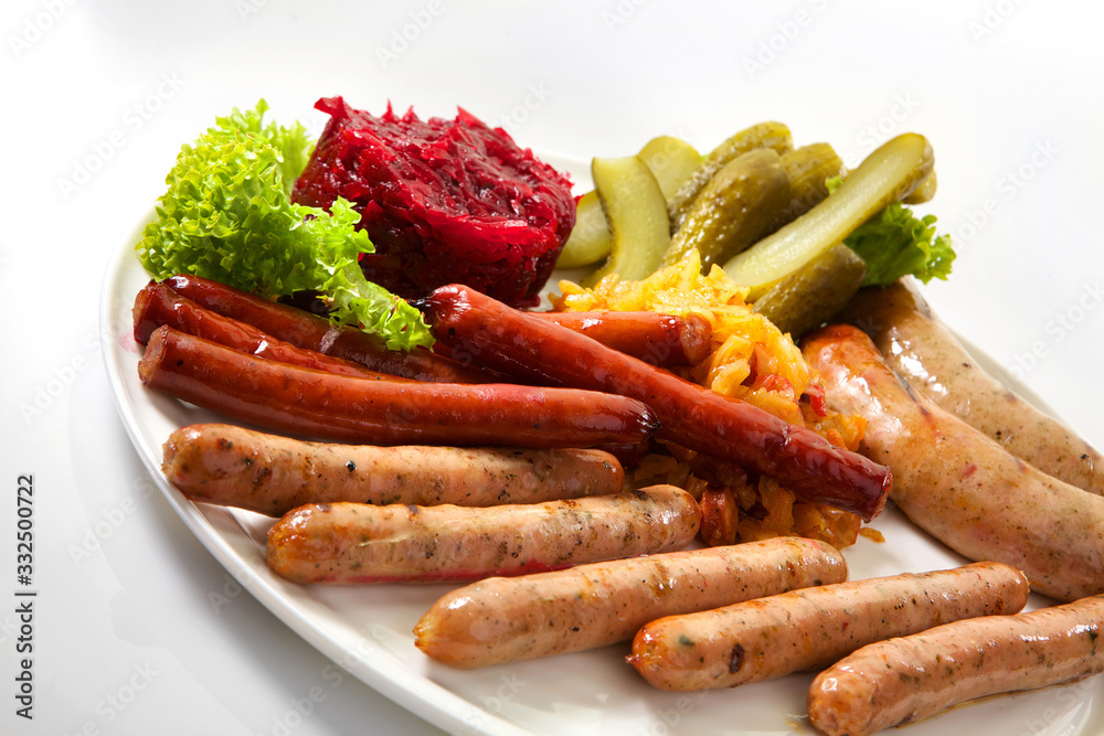 Assortment of sausages isolated on white background