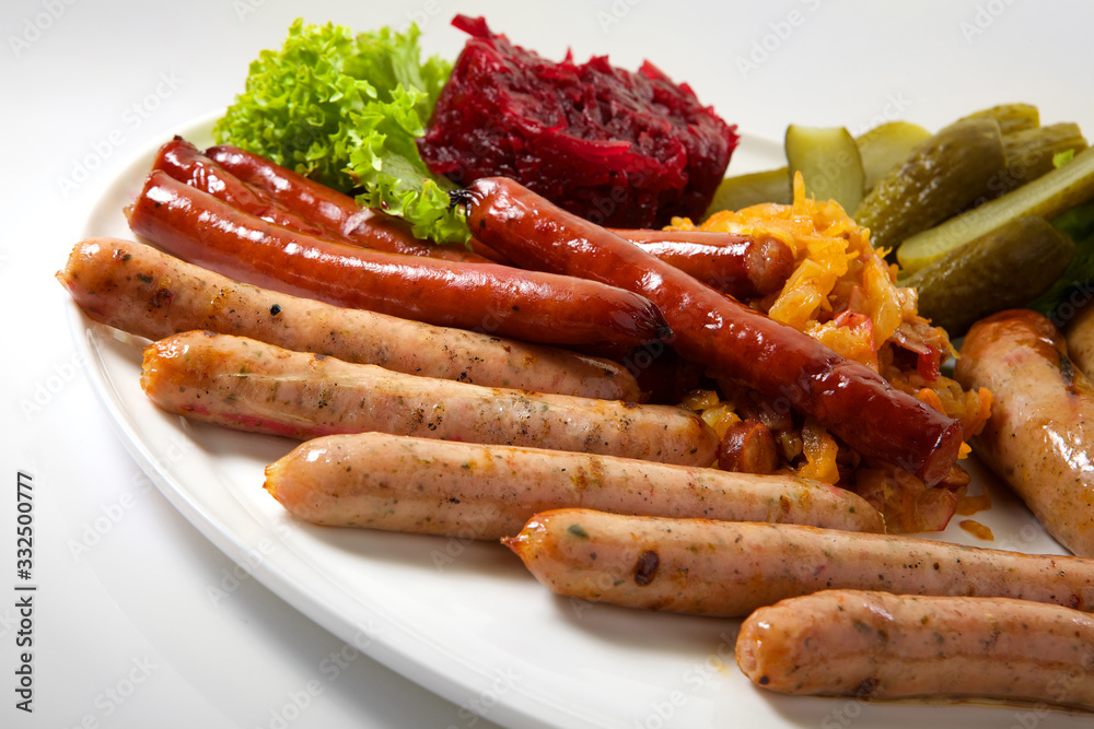 Assortment of sausages isolated on white background