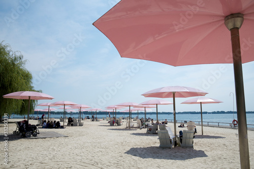 Canvas Print Beach with pink colour umbrella