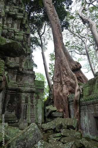 Scenic landscape of destroyed religious Hindu temple and trees of Angkor Wat in Cambodia