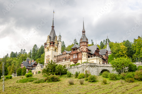 The Peles Castle on a cloudy rainy autumn day photo