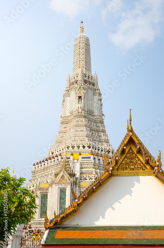The Spire and a roof at the Wat Arun temple in Bngkok  Thailand  on a sunny warm day