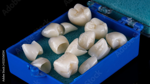 set of zircon crowns for prosthetics of the patient in a blue case for transportation
