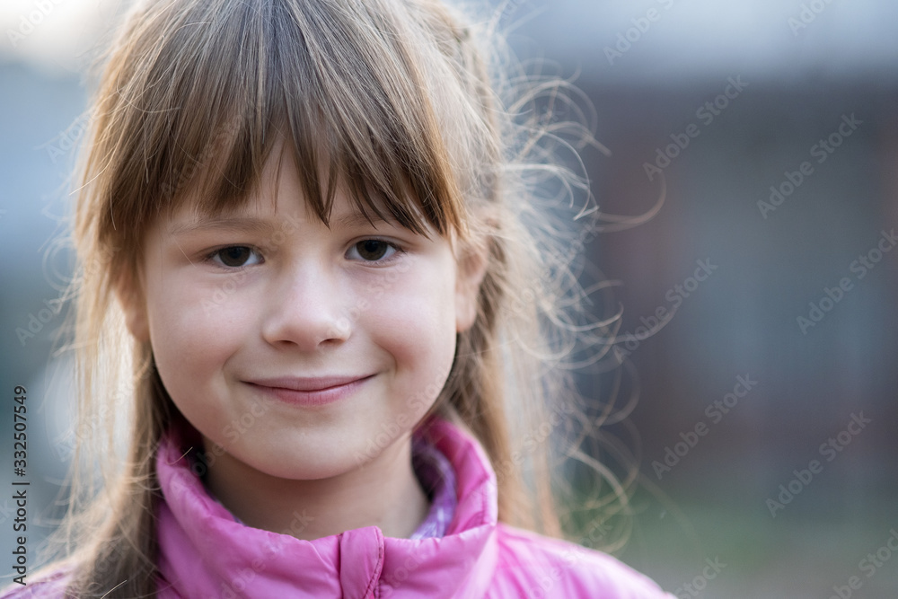 Portrait of happy child girl in warm clothes in autumn outdoors. Portrait of happy child girl in warm clothes in autumn outdoors.