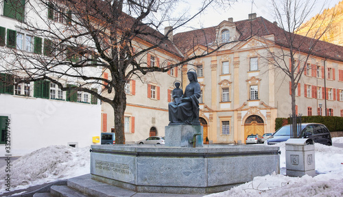 Monument near Cathedral of the Assumption in Chur at sunrise
