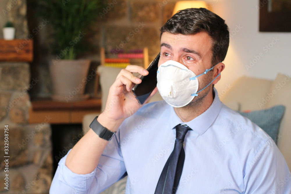 Businessman crying during stay at home order Businessman crying during stay at home order