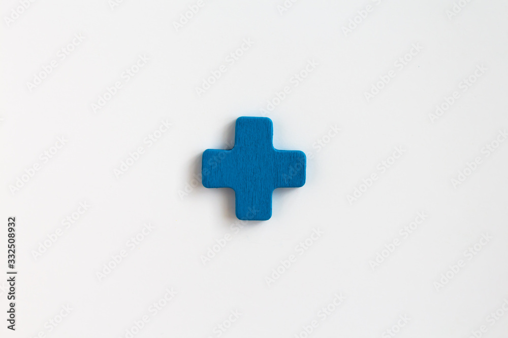 blue painted wooden plus, craft sign for kid's education isolated, ecological concept blue painted wooden plus, craft sign for kid's education isolated, ecological concept