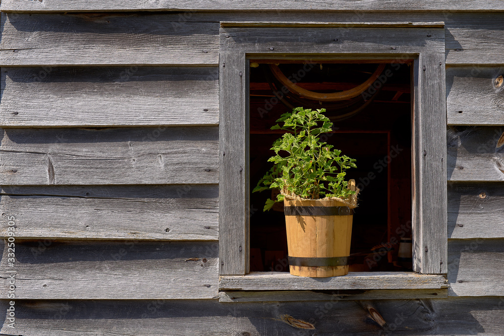 beautiful antique window in a wooden house in the open-air museum of the Canada countryside