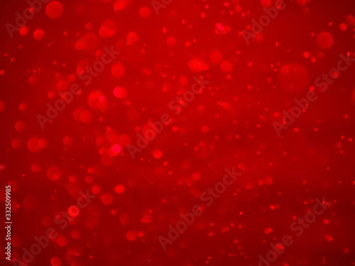 Red tone blur bokeh light. Defocused texture background.