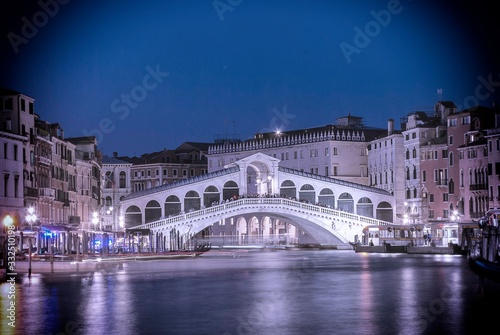 The Rialto Bridge over the Grand Canal in Venice, Italy at night