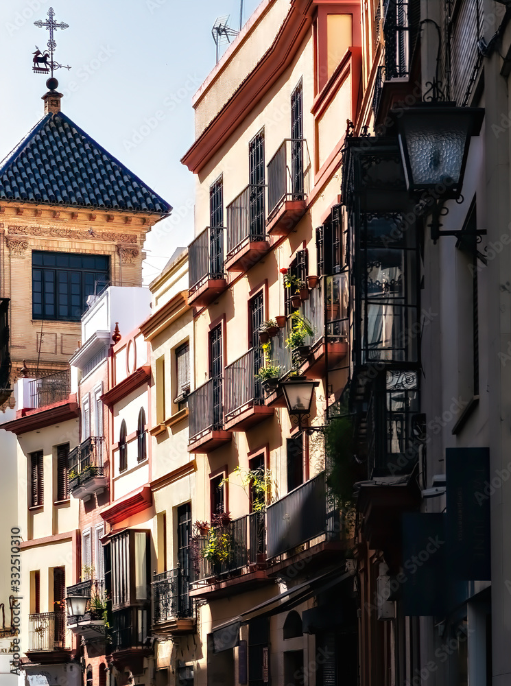 View of traditional architecture in a street of the city of Seville, Spain.