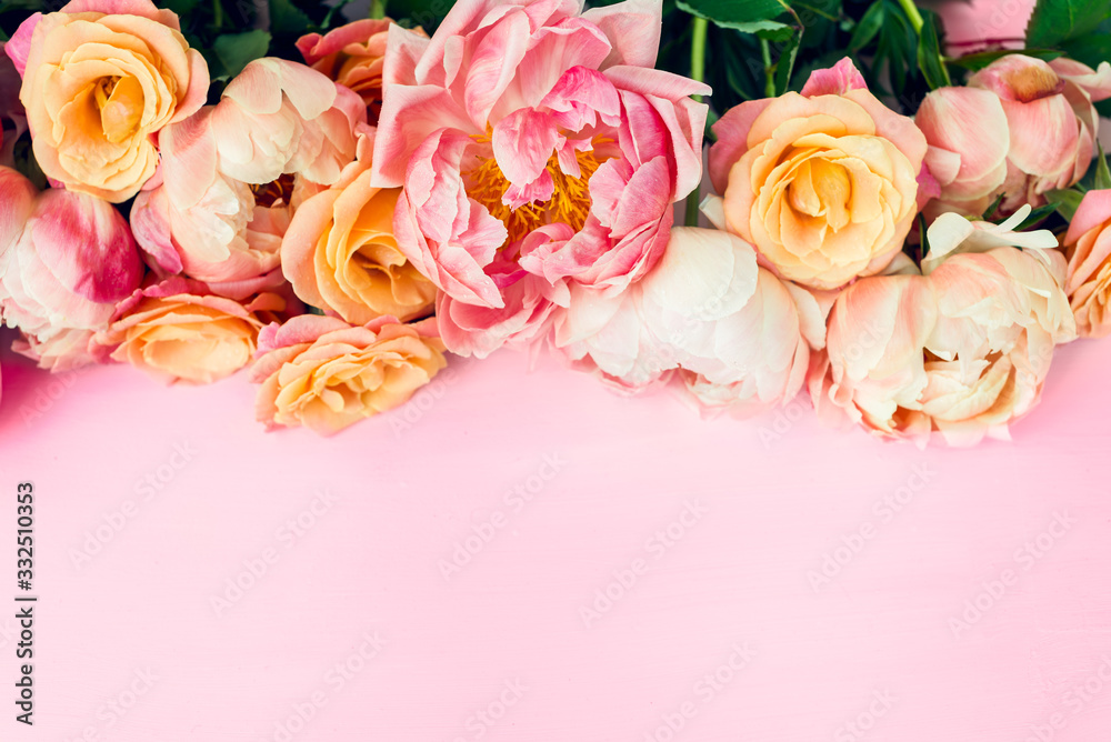 Fresh bunch of pink peonies and roses on pink background. Card Concept, pastel colors, close up image, copy space
