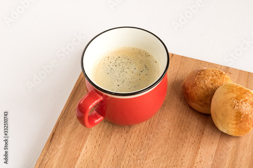 Red espresso coffee cup on wood tray. Close up  selective focus