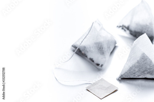 Pyramid teabags on white table mock-up © 279photo