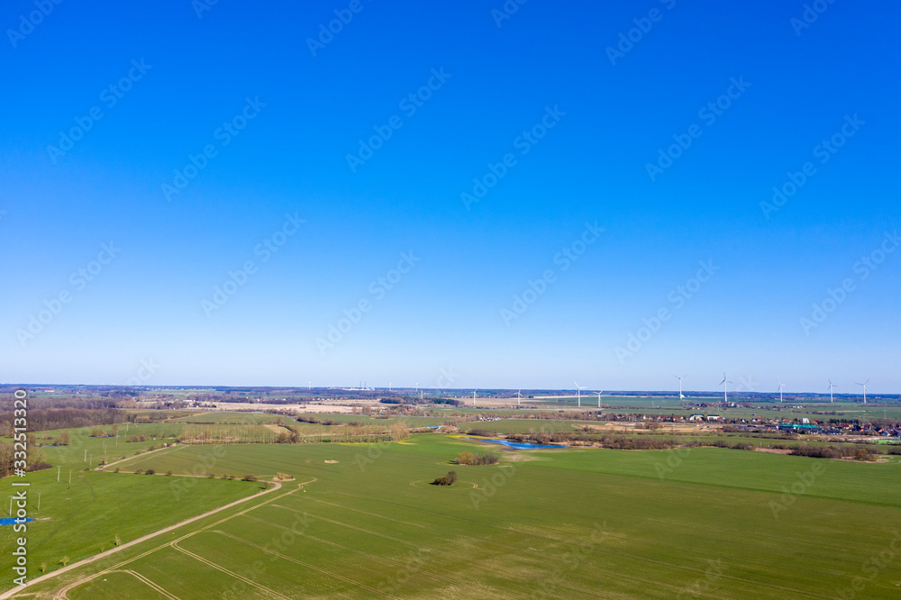 Landscape in the north of Germany with windmill power generators in the background