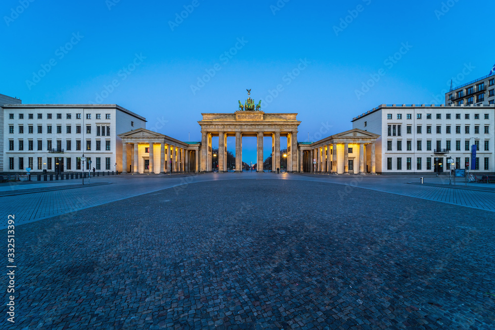 Pariser Platz and Brandenburg Gate. Early morning. Desert area caused by quarantine as a result of coronavirus infection. Berlin, Germany. March 2020. Pariser Platz and Brandenburg Gate. Early morning. Desert area caused by quarantine as a result of coronavirus infection. Berlin, Germany. March 2020.