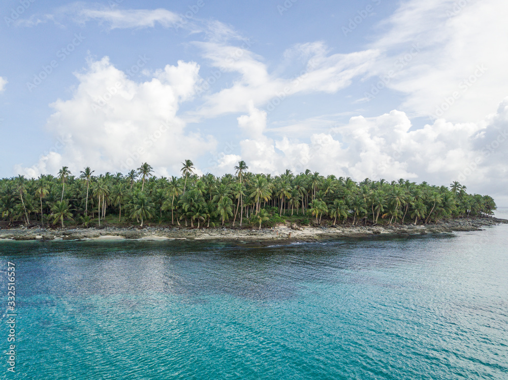 Scenic aerial of tropical island rocky beach