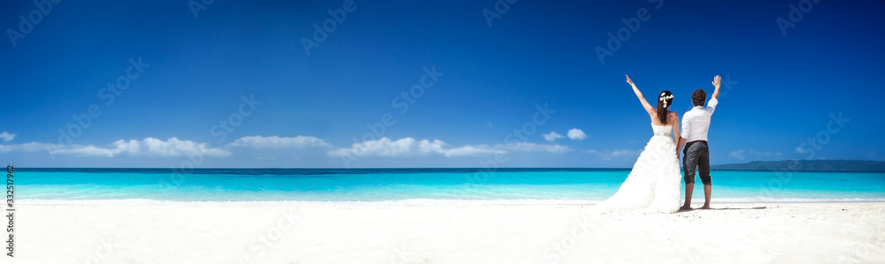 Couple on caribbean beach. Tropical Wedding