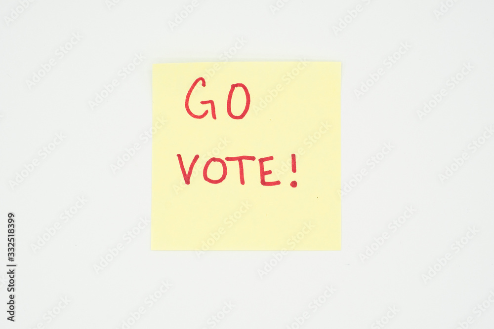 Go vote! written on a yellow sticky note with copyspace. Presidential election 2020 Go vote! written on a yellow sticky note with copyspace. Presidential election 2020