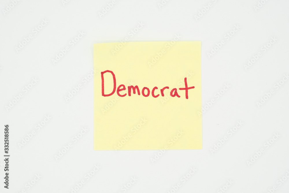 Democrat written on a yellow sticky note with copyspace. Presidential election 2020 Democrat written on a yellow sticky note with copyspace. Presidential election 2020