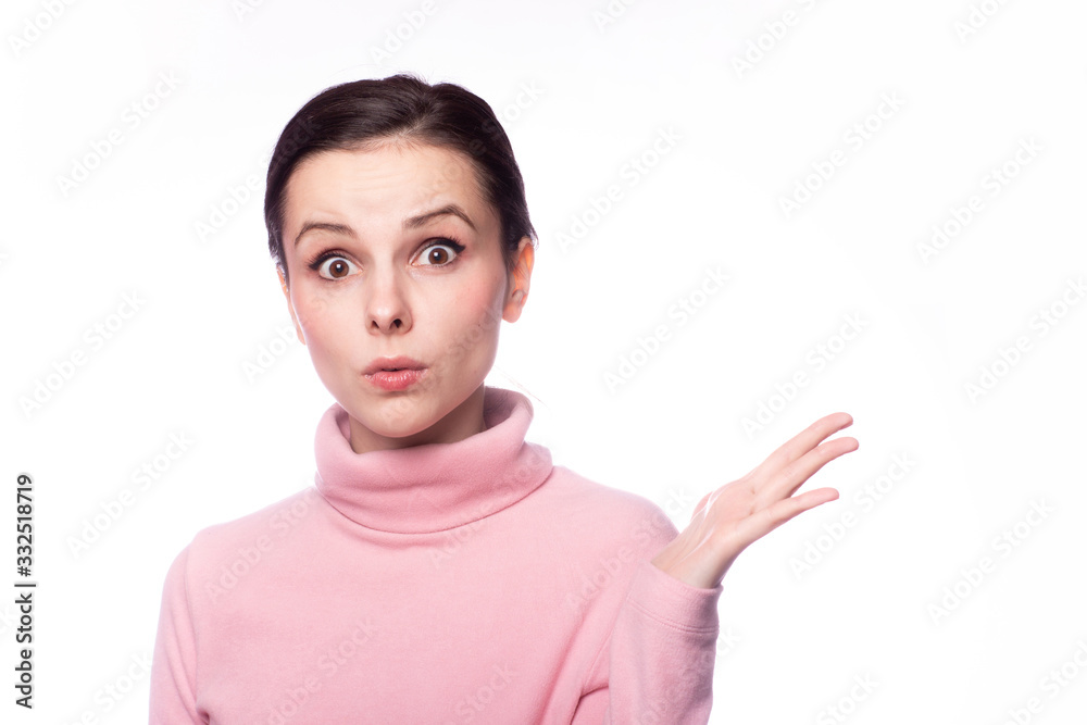 beautiful girl in a pink turtleneck talking on the phone on a white background beautiful girl in a pink turtleneck talking on the phone on a white background