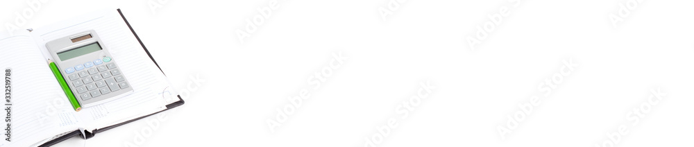 Calculator and pencil on notebook, closeup on white background Calculator and pencil on notebook, closeup on white background