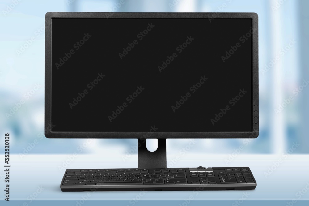 Modern desktop computer and keyboard on the desk Modern desktop computer and keyboard on the desk