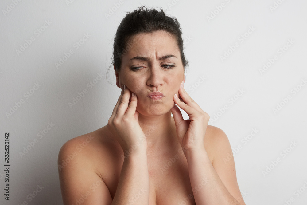 Young woman suffering toothache. Portrait in the studio. Young woman suffering toothache. Portrait in the studio.