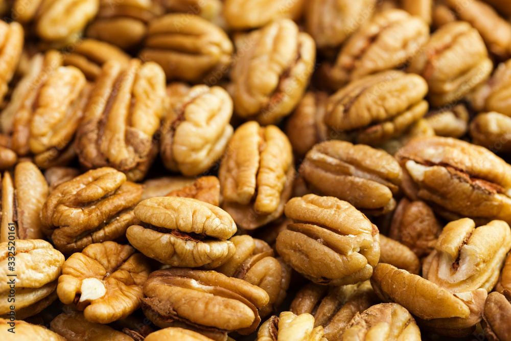 Pecan nuts background. Closeup pekan seeds Pecan nuts background. Closeup pekan seeds