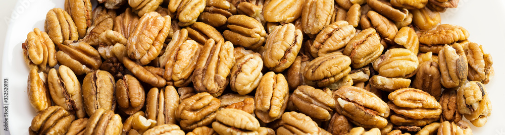 Pecan nuts background. Closeup pekan seeds Pecan nuts background. Closeup pekan seeds