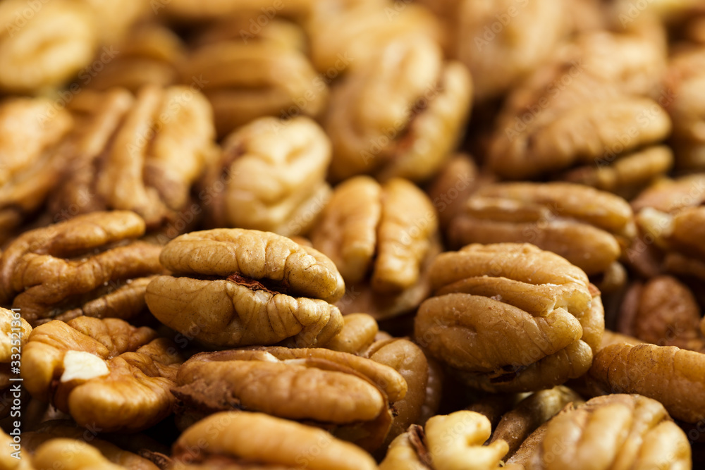 Pecan nuts background. Closeup pekan seeds Pecan nuts background. Closeup pekan seeds