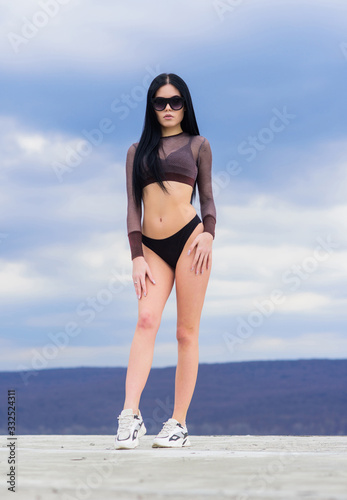 sexy woman with fit body. sport and fitness. Sky. perfect body with no cellulite and fat. freedom. sensual girl in underwear lingerie and sunglasses outdoor. summer fashion beauty. sexy woman photo