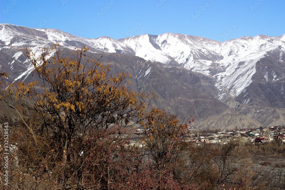 Mountain landscape in green valley with river. Beautiful landscape of the Caucasus mountains. Beautiful landscape of the Caucasus rocky mountains Mountain landscape in green valley with river. Beautiful landscape of the Caucasus mountains. Beautiful landscape of the Caucasus rocky mountains