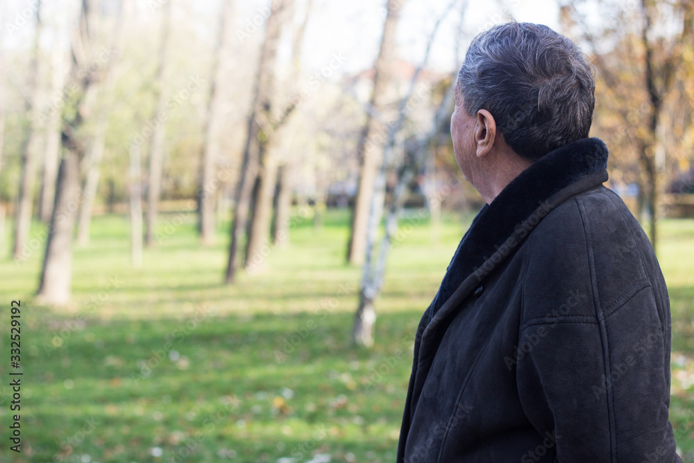 Senior man walking and relaxing in park Senior man walking and relaxing in park