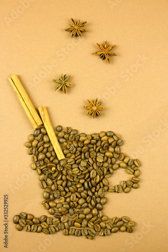 cup of coffee lined with coffee beans and aromatic spices, coffee mood concept
