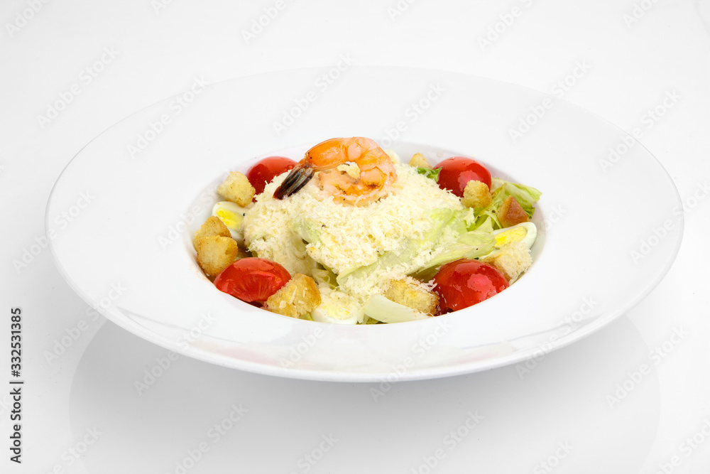 Salad with fresh vegetables and shrimp on a white plate Salad with fresh vegetables and shrimp on a white plate