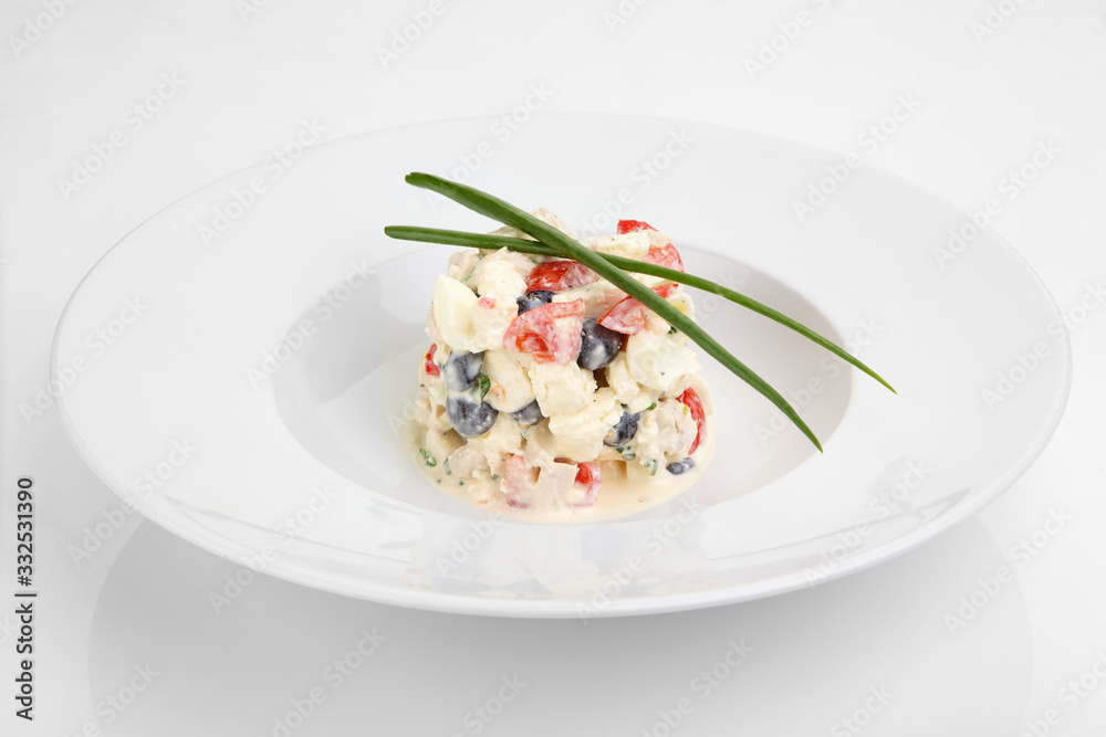 Salad with fresh vegetables, eggs and chicken meat on white plate Salad with fresh vegetables, eggs and chicken meat on white plate