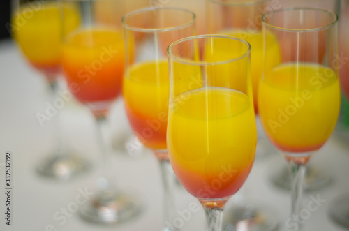 beautiful luxury juice in a wine glass. Rich drink during presentation. Healthy drink in a glass of squeezed fruit