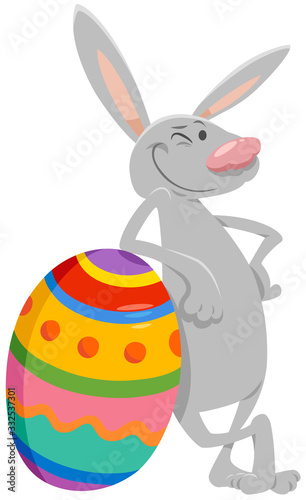 cartoon Easter bunny with big colored egg