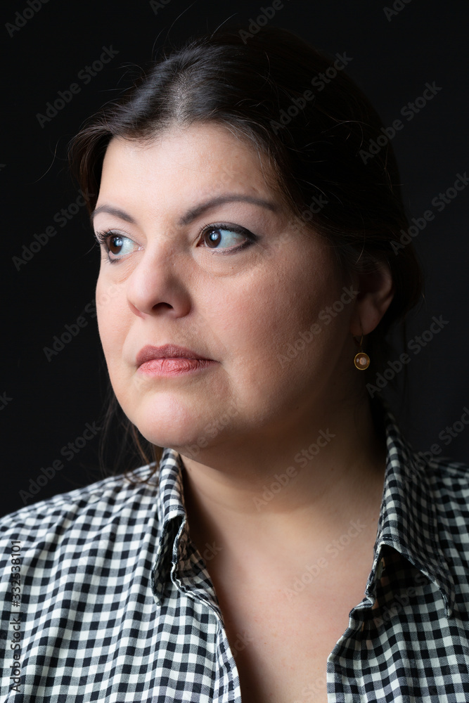 Lady head shot studio portrait. She is serious and looking away. Lady head shot studio portrait. She is serious and looking away.