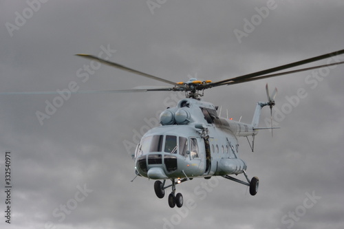 A UN helicopter flies across the field to save people from the flood.